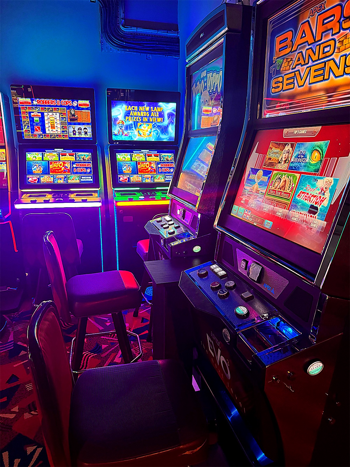 Seats along a row of machines