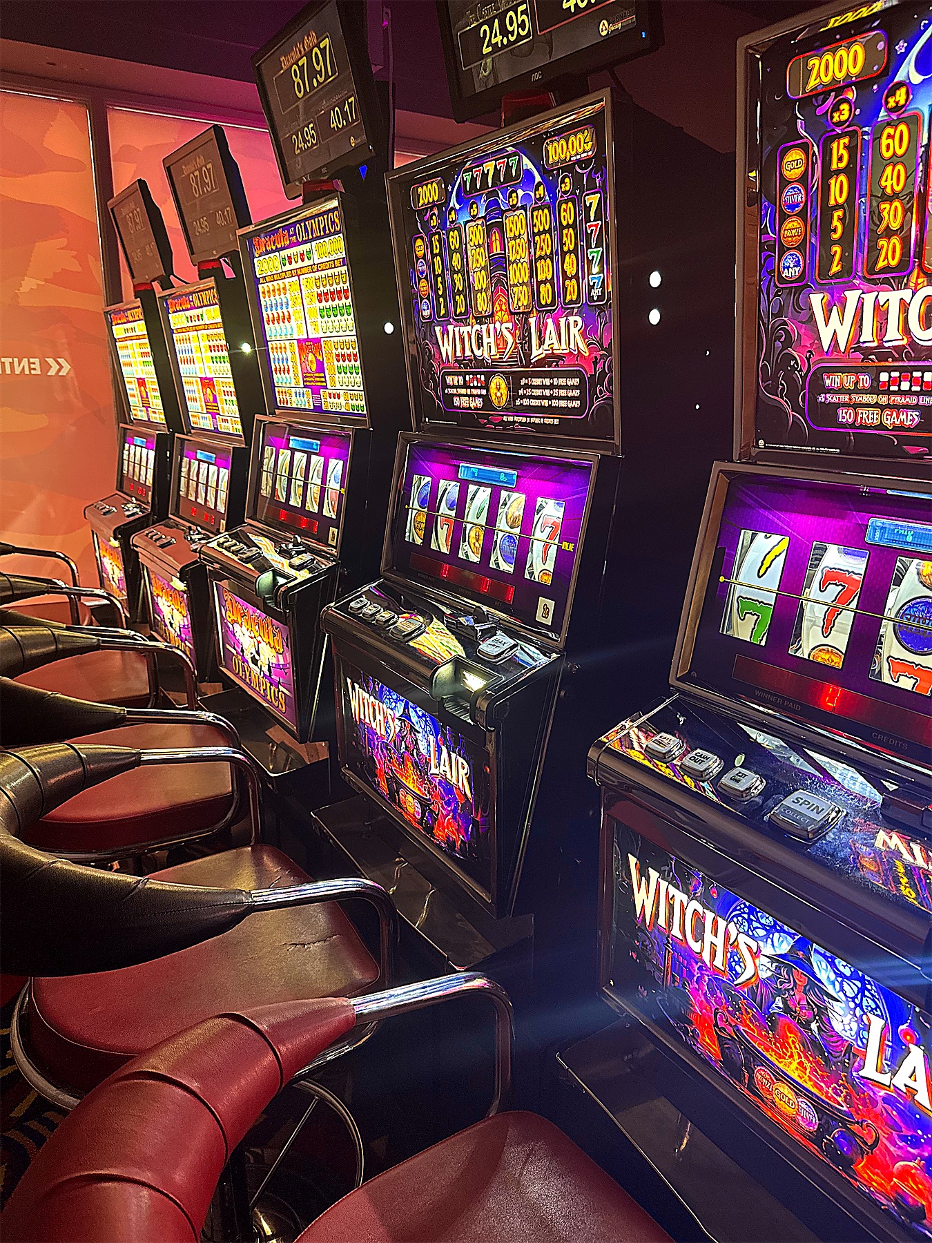 Slot machines with maroon leather seats